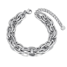 Load image into Gallery viewer, Make a bold statement with this oval circle handmade chain bracelet, meticulously crafted with alternating notched links for added texture and style. Plated in luxurious 18K gold, this stunning piece exudes sophistication and elegance, while the stainless steel construction ensures it remains waterproof and tarnish-free for lasting beauty. Perfect for any occasion, this eye-catching bracelet offers both durability and fashion-forward design, making it a versatile accessory for daily wear or special events.