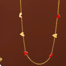 Load image into Gallery viewer, Charming gold plated stainless steel necklace comes in a gold colour. It is adorned with irregular shaped hearts in red and gold combination. This necklace is a perfect piece for any daily or evening outfit. It is also a great present for your loved ones. The necklace has a lobster clasp and adjustable length.