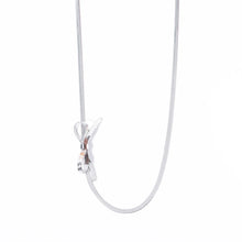 Load image into Gallery viewer, This minimalist choker necklace features a delicate knot bow design, crafted from a sleek, 18K gold-plated tiny snake chain that sits elegantly on the neck. Made from high-quality stainless steel, it combines simplicity with sophistication, making it the perfect accessory for weddings or special occasions.
