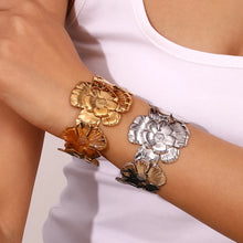 Load image into Gallery viewer, Make a statement with this elegant wide cuff bracelet, featuring beautifully exaggerated floral details for a bold yet sophisticated look. Crafted from premium stainless steel, it’s durable, stylish, and designed for all-day comfort. Perfect for adding a touch of elegance to any outfit, this stunning piece is a must-have for any jewelry collection!