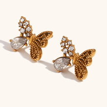 Load image into Gallery viewer, Add a touch of whimsy to your look with these asymmetric mini butterfly earrings, beautifully inlaid with sparkling zirconium. Crafted from durable stainless steel, these earrings are waterproof and perfect for daily wear. Their unique design exudes elegance and charm, making them a stylish accessory or a thoughtful gift for any occasion.