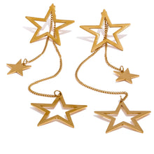 Load image into Gallery viewer, Shine bright with these fashion star long drop dangle earrings, a dazzling addition to any jewelry collection. Adorned with two larger star contours and two smaller star charms, these earrings are beautifully crafted from stainless steel and plated in 18K gold for a radiant, luxurious finish. Their elongated design offers graceful movement and a striking silhouette, perfect for adding a touch of glamour to any outfit.