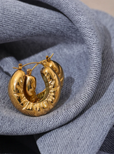 Load image into Gallery viewer, These elegant, chunky hoop earrings are crafted from durable stainless steel with a radiant gold finish, designed to bring a touch of sophistication to everyday looks. Featuring a unique crumpled texture along the edges, they add a modern twist to the classic hoop, making them a standout piece for any occasion. Lightweight yet bold, these hollow hoops are perfect for daily wear and make a thoughtful gift for any woman who appreciates stylish, personalized jewelry.