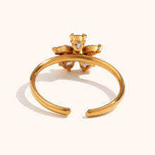Load image into Gallery viewer, Add a touch of elegance to your look with this five petal zircon ring, crafted from durable stainless steel for a sleek and lasting finish. Featuring a delicate five-petal flower design adorned with sparkling zircon, this ring is both stylish and waterproof, perfect for daily wear. A timeless accessory that enhances any outfit, making it an ideal gift or a beautiful addition to your jewelry collection.