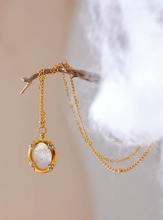 Load image into Gallery viewer, Add a touch of elegance to your look with this chic luxury round pendant necklace. Featuring a natural shell accented with a sparkling zircons and carved bee, this graceful design exudes French-inspired charm. Crafted from durable stainless steel, it’s waterproof and perfect for everyday wear or special occasions. A sophisticated accessory that blends style and durability, making it a timeless addition to any jewelry collection.