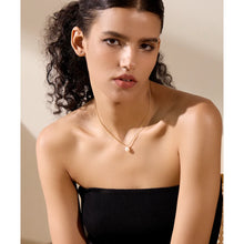 Load image into Gallery viewer, Elevate your style with this stunning gold-colored stainless steel necklace, featuring a uniquely patterned chain that exudes sophistication. Accentuated by a natural freshwater pearl pendant, it’s the perfect accessory for adding a touch of elegance to any glamorous occasion. Designed with both beauty and comfort in mind, it includes a secure lobster clasp and an adjustable chain for a customizable fit. Add this timeless piece to your collection for a refined look that complements any outfit.