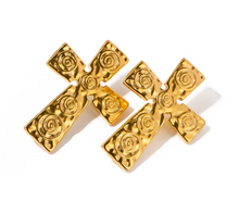 Load image into Gallery viewer, Make a bold statement with these trendy stainless steel cross carved stud earrings. Featuring intricate tribal-inspired carvings, these earrings add a unique, edgy touch to any outfit. Crafted from durable stainless steel, they offer both style and longevity, making them the perfect accessory for those who love standout, statement jewelry.