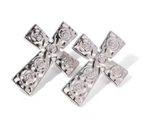 Load image into Gallery viewer, Make a bold statement with these trendy stainless steel cross carved stud earrings. Featuring intricate tribal-inspired carvings, these earrings add a unique, edgy touch to any outfit. Crafted from durable stainless steel, they offer both style and longevity, making them the perfect accessory for those who love standout, statement jewelry.