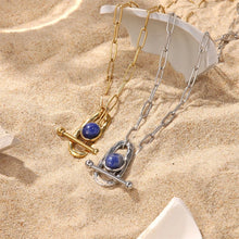 Load image into Gallery viewer, This circle hollow pendant necklace is made out of 18K gold plated stainless steel and it is adorned with cubic zirconia. It is a perfect piece for an elegant occasion outfit. The necklace has a size adjustable chain with a lobster clasp.