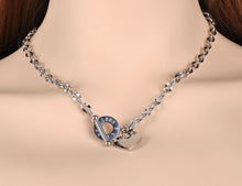 Load image into Gallery viewer,  Stainless steel necklace is coming in two colours: rose gold and silver. Big pedant in the shape of a heart is placed at the bottom part. There is a bible proverb engraved on the heart: "Above all else, guard your heart, for everything you do flows from it." Big toggle clasp with engraved letters makes the necklace even more dominant. 