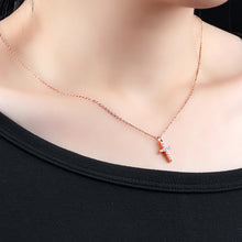 Load image into Gallery viewer, Simple and elegant necklace is made of 316L stainless steel. It comes in two colours: rose gold and silver. It has a small pedant in a shape of a cross adorned with cubic zirconia. It is perfect for everyday occasions as well as a gift for Baptism, First Holly Communion or Sacrament of Confirmation. The necklace has lobster clasp.