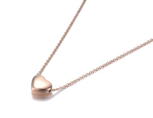 Load image into Gallery viewer, Stainless steel chain necklace comes in two colours: rose gold and silver. It is adorned with a small pedant in a shape of a heart. Simple and elegant design makes this necklace perfect for any outfit. It has adjustable length and lobster clasp.