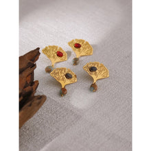 Load image into Gallery viewer, Exquisite stainless steel earrings are made in a gold colour. They are made in a shape of a ginkgo leave which is additionally adorned with natural stone. One smaller stone is placed on the leave and can come in red or green colour. Other bigger stone is hanging under the leave and it has turquoise colour. Earrings have real gold plating and represent great accessory to your everyday outfit. They have stud fastening.