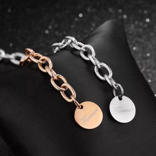 Load image into Gallery viewer, Beautiful stainless steel bracelet comes in two colours: rose gold and silver. It is made of rugged link chain which is adorned with circle charm and word: 'Forever'. The bracelet has adjustable length and lobster clasp. Its simplicity makes it perfect accessories to any outfit.