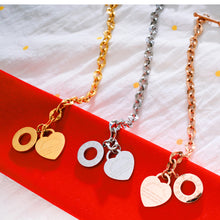 Load image into Gallery viewer, Bracelet is made of stainless steel and comes in three colours: rose gold, gold and silver. It is adorned with a heart pedant with following engraving: 'Above all else guard your heart. For everything you do flows from it'. A big toggle clasp additionally makes it beautiful and statement.