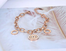 Load image into Gallery viewer, Beautiful stainless steel bracelet is made of a big linked chain and adorned with three circles. Main circle is richly adorned with two circles of cubic zirconia and engraved roman numerals. Other two circles are smaller and have roman numerals around its perimeter. The length is adjustable and bracelet has lobster closure.