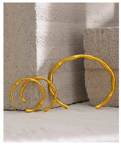 Load image into Gallery viewer, Bangle bracelet is made of stainless steel and comes in gold colour. It has a real gold plating and is adorned with bamboo pattern. Its simplicity and elegance makes it perfect accessory for any outfit.