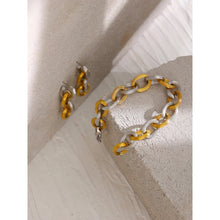 Load image into Gallery viewer, This beautiful bracelet is made of big statement links with notches on its surface. Links come in two colours: gold and silver. Bracelet has lobster clasp and makes perfect statement piece for your statement outfit.
