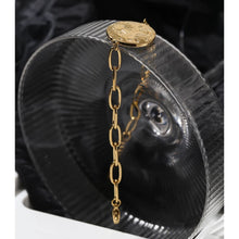 Load image into Gallery viewer, Bracelet is made of stainless steel and has real gold plating. Its link chain is adorned with medallion. Medallion has engraved sun, moon and little stars. The bracelet has adjustable length and lobster closer. It is perfect for everyday occasions.