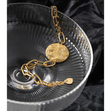 Load image into Gallery viewer, Bracelet is made of stainless steel and has real gold plating. Its link chain is adorned with medallion. Medallion has engraved sun, moon and little stars. The bracelet has adjustable length and lobster closer. It is perfect for everyday occasions.