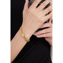 Load image into Gallery viewer, Bracelet is made of stainless steel and has real gold plating. It comes in two colours: gold and silver. It is adorned with a shell plate circled by engraved roman numerals. It has watch clasp and it is a perfect accessory for your smart outfit.