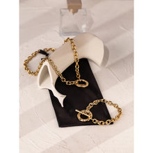 Load image into Gallery viewer, Bracelet is made of stainless steel and comes in a gold colour with real gold plating. It is made of a thick statement chain which is adorned with big toggle clasp at the end. Bracelet is a real statement piece that will glam up your outfit.