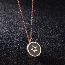 Load image into Gallery viewer, This beautiful necklace is made of stainless steel that is rose gold plated. It has link chain and pedant in a shape of a circle. Pedant is made of a shell and comes in two colours: white and black. The pedant is adorned with little star in rose gold colour. The necklace has adjustable length and lobster clasp.
