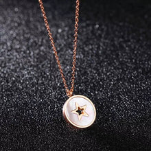 Load image into Gallery viewer, This beautiful necklace is made of stainless steel that is rose gold plated. It has link chain and pedant in a shape of a circle. Pedant is made of a shell and comes in two colours: white and black. The pedant is adorned with little star in rose gold colour. The necklace has adjustable length and lobster clasp.