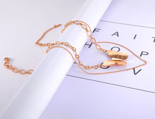 Load image into Gallery viewer, Bohemian stainless steel necklace comes in a rose gold colour. It is a double layered necklace made of fine thin chain and thicker link chain adorned with statement pedant in a shape of a butterfly. The necklace is perfect for your evening outfit. It has adjustable length and lobster clasp.