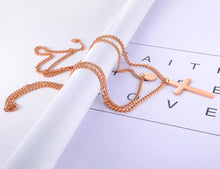 Load image into Gallery viewer, Stainless steel neo-gothic necklace comes in a rose gold and silver colour. It is made of double layered chain. Shorter and thinner chain has a circle pedant with St. Benedict and longer and thicker chain is adorned with a big cross pedant. This statement necklace is perfect to glam up your outfit. It has lobster clasp.
