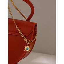 Load image into Gallery viewer, Stainless steel necklace comes in a gold colour and it is three times gold plated. The necklace is made of a thicker link chain which is adorned with a sun pedant and bigger toggle clasp. Sun is adorned with a blue stone that is surrounded with golden rays. This statement necklace is perfect to spice up any outfit.