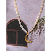 Load image into Gallery viewer, Natural pearl necklace comes in a white colour. It is made of natural pearls and it is adorned with a moon pedant. Moon is made of stainless steel and comes in a gold colour. The pedant is three times gold plated. This necklace is perfect for elegant evening outfit. It has adjustable length and lobster clasp.