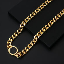 Load image into Gallery viewer, Necklace is made of stainless steel and comes in a gold colour with real gold plating. It is made of a thick link chain which is adorned with double sided medallion. Medallion can be worn on white or black side. It is additionally adorned with engraved roman numerals around its perimeter. Necklace is a real statement piece that will glam up your outfit.