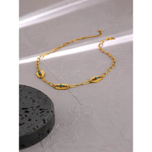 Load image into Gallery viewer, Necklace is made of stainless steel and comes in a gold colour with real gold plating. It is made of a big link chain which is adorned with three eyes with blue rocks in the middle.This very interesting necklace is a real statement piece that will glam up your outfit. It has adjustable length and lobster clasp.