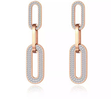 Load image into Gallery viewer, Very elegant and beautiful earrings have two colours variants: rose gold and silver. These statement earrings are consisting of three big chain links. The first and the last link are adorned with cubic zirconia which gives them classy and elegant look. Stud closure.
