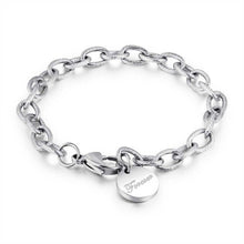 Load image into Gallery viewer, Beautiful stainless steel bracelet comes in two colours: rose gold and silver. It is made of rugged link chain which is adorned with circle charm and word: 'Forever'. The bracelet has adjustable length and lobster clasp. Its simplicity makes it perfect accessories to any outfit.