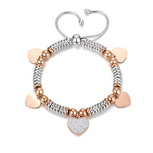 Load image into Gallery viewer, Stainless steel bracelet comes in a combination of two colours: rose gold and silver. It is made of beads in two different colours and additionally adorned with 5 pedants. Pedants come in four shapes: star, heart, butterfly or elephant. Four pedants on a bracelet are smaller in rose gold colour and one is bigger, richly adorned with cubic zirconia. The length is adjustable with a lace up closure.