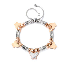 Load image into Gallery viewer, Stainless steel bracelet comes in a combination of two colours: rose gold and silver. It is made of beads in two different colours and additionally adorned with 5 pedants. Pedants come in four shapes: star, heart, butterfly or elephant. Four pedants on a bracelet are smaller in rose gold colour and one is bigger, richly adorned with cubic zirconia. The length is adjustable with a lace up closure.