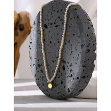 Load image into Gallery viewer, Stylish necklace is handmade of natural pearls in white colour. It is adorned with a little plate in a shape of a circle. The plate is made of stainless steel and comes in gold colour. This necklace is very elegant and it will bring your outfit to a next level. It has adjustable length and lobster clasp.