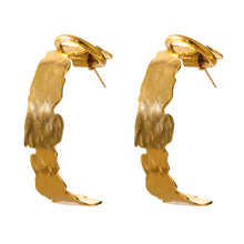 Load image into Gallery viewer, Elegant stainless steel earrings are made in a gold colour. They are in a shape of a hoop with irregular border, which gives them even classier look. Earrings have real gold plating and represent great accessory to your everyday outfit. They have stud fastening.