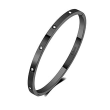 Load image into Gallery viewer, Elegant bangle bracelet is made of stainless steel and comes in four colours: rose gold, gold, black and silver. It is adorned around its perimeter with sparkling cubic zirconia crystals. It is perfect accessory for evening occasions and will sparkle your every outfit.