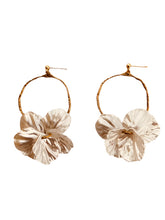 Load image into Gallery viewer, Add a touch of delicate elegance to your look with these minimalistic stud earrings. Featuring thin stainless steel circles adorned with shell flower petals, they offer a perfect blend of modern simplicity and natural beauty. Lightweight and versatile, these earrings are ideal for everyday wear or special occasions, effortlessly complementing any outfit with their subtle charm.
