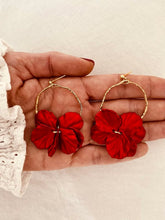Load image into Gallery viewer, Add a touch of delicate elegance to your look with these minimalistic stud earrings. Featuring thin stainless steel circles adorned with shell flower petals, they offer a perfect blend of modern simplicity and natural beauty. Lightweight and versatile, these earrings are ideal for everyday wear or special occasions, effortlessly complementing any outfit with their subtle charm.
