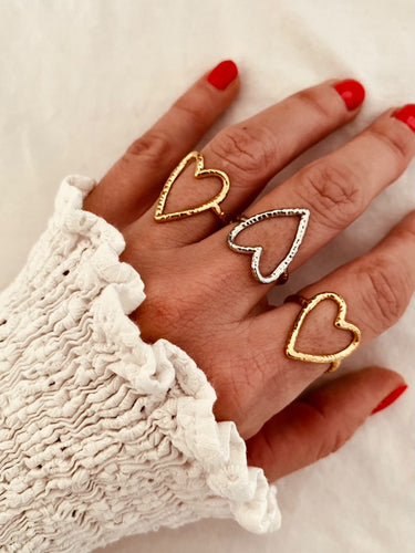 Fall in love with the effortless charm of this stainless steel hollow heart ring — a minimalistic statement piece with a romantic twist. Featuring a sleek open design and a delicate heart-shaped cutout, this ring blends Western-inspired style with modern simplicity. Available in both polished silver and radiant gold finishes, it's the perfect accessory for adding a subtle touch of elegance to your everyday look or party outfit. Durable, waterproof, and endlessly versatile, it also makes a thoughtful gift th