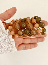 Load image into Gallery viewer, Add a touch of modern elegance to your look with these resin round beads chain C-Shape huggie earrings. Handmade with care, they feature glossy resin round beads paired with a sleek stainless steel chain for a lightweight yet durable finish. Inspired by trendy French fashion, these C-shape huggie earrings offer a stylish balance of chic and contemporary design, making them perfect for everyday wear or special occasions. A must-have statement accessory for women who love unique, fashionable jewelry.
