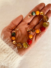 Load image into Gallery viewer, Add a touch of modern elegance to your look with these resin round beads chain C-Shape huggie earrings. Handmade with care, they feature glossy resin round beads paired with a sleek stainless steel chain for a lightweight yet durable finish. Inspired by trendy French fashion, these C-shape huggie earrings offer a stylish balance of chic and contemporary design, making them perfect for everyday wear or special occasions. A must-have statement accessory for women who love unique, fashionable jewelry.
