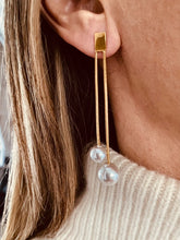Load image into Gallery viewer, Add timeless elegance to your look with these tassel imitation pearl earrings, designed to elevate both everyday and special occasion outfits. Made from durable stainless steel with a luxurious gold-plated finish, they feature graceful tassels and lustrous imitation pearls for a refined, fashionable touch. Lightweight and comfortable to wear, these earrings are a perfect accessory for modern women and make a beautiful gift for any occasion.
