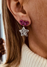 Load image into Gallery viewer, mall star-shaped earrings on a model
