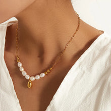 Load image into Gallery viewer, Stainless steel necklace is made as an interesting combination of chain and gold and white pearls. It is additionally adorned with a gold pendant in a shape of a teardrop.&nbsp; This beautiful and charming necklace is a great accessory for evening night out. The necklace has a lobster clasp and adjustable length.
