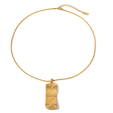 Load image into Gallery viewer, Elevate your style with this sleek and modern stainless steel threaded rectangle geometric pendant necklace. Featuring a unique notched design, the geometric pendant adds a touch of sophistication and contemporary charm to any outfit, making it ideal for both casual and formal occasions. Crafted from durable stainless steel, this necklace is resistant to tarnish and wear, ensuring lasting shine and beauty.
